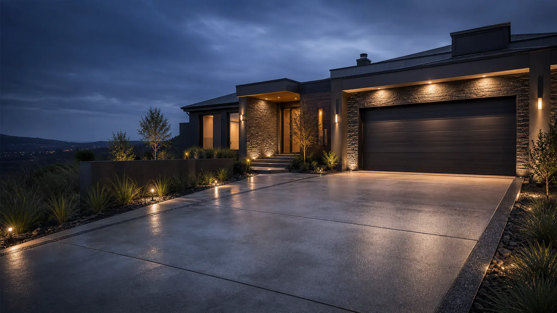 Premium concrete driveway leading to a modern Dunedin home at dusk